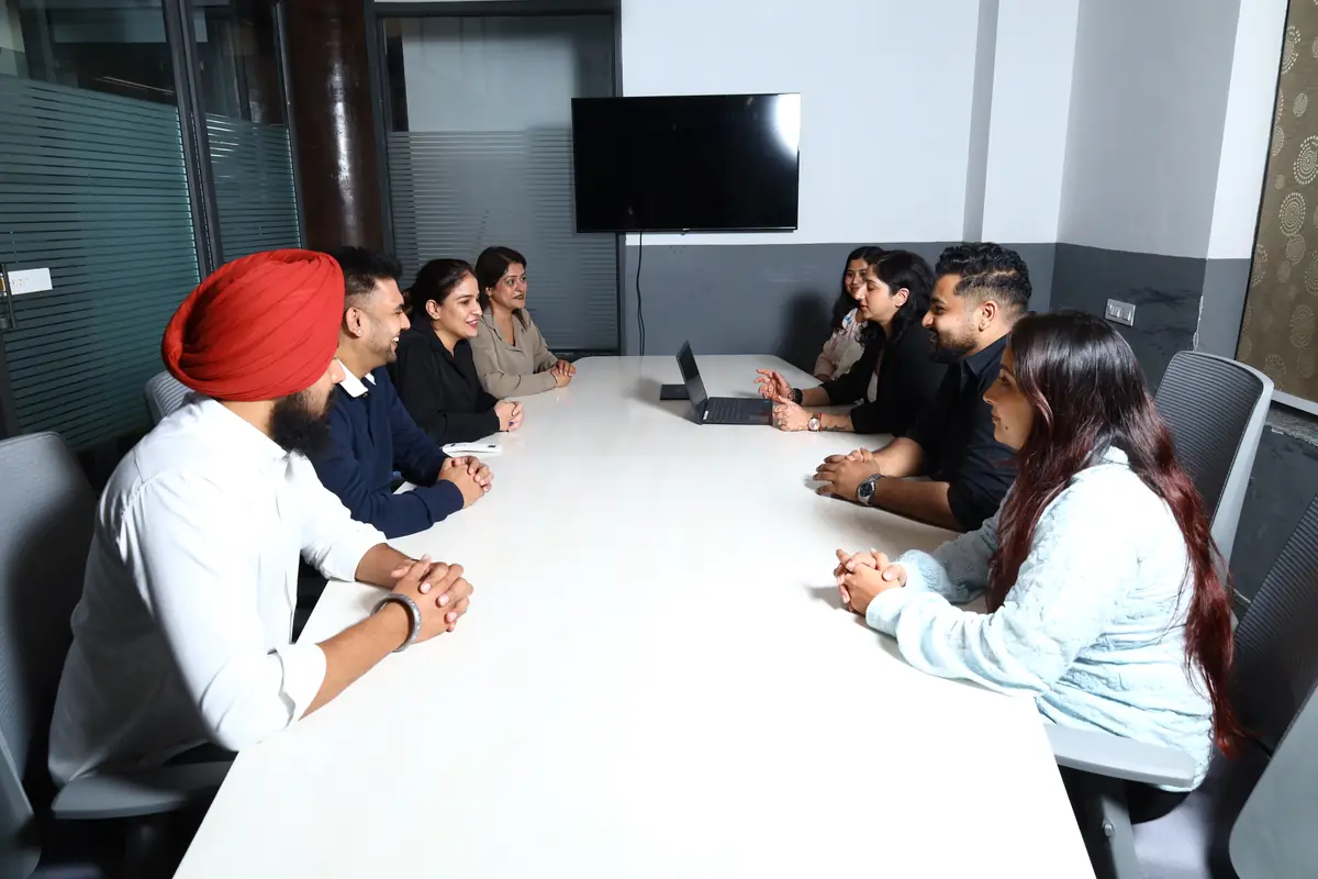 The Peak Process Partners team in a meeting in the Mohali office